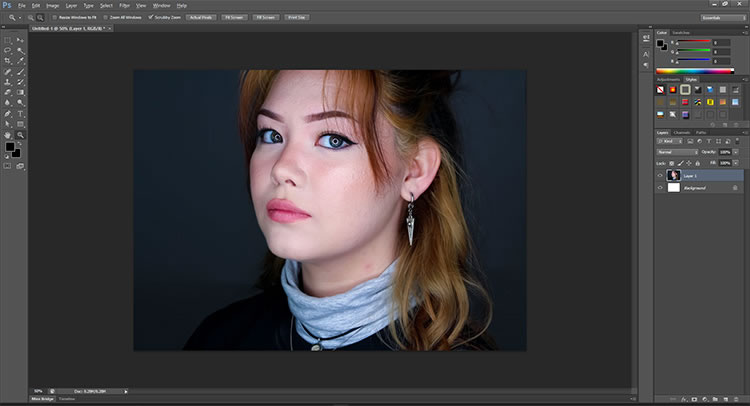 A screenshot of a picture of a young woman being edited in Photoshop. 