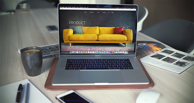 A picture of a laptop with a microsite of a furniture store on the screen.